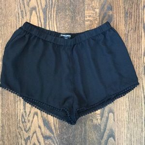 Black flowy shorts with small fringe
